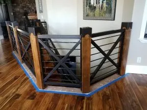 Black metal and wood interior stair and loft railing with horizontal bars
